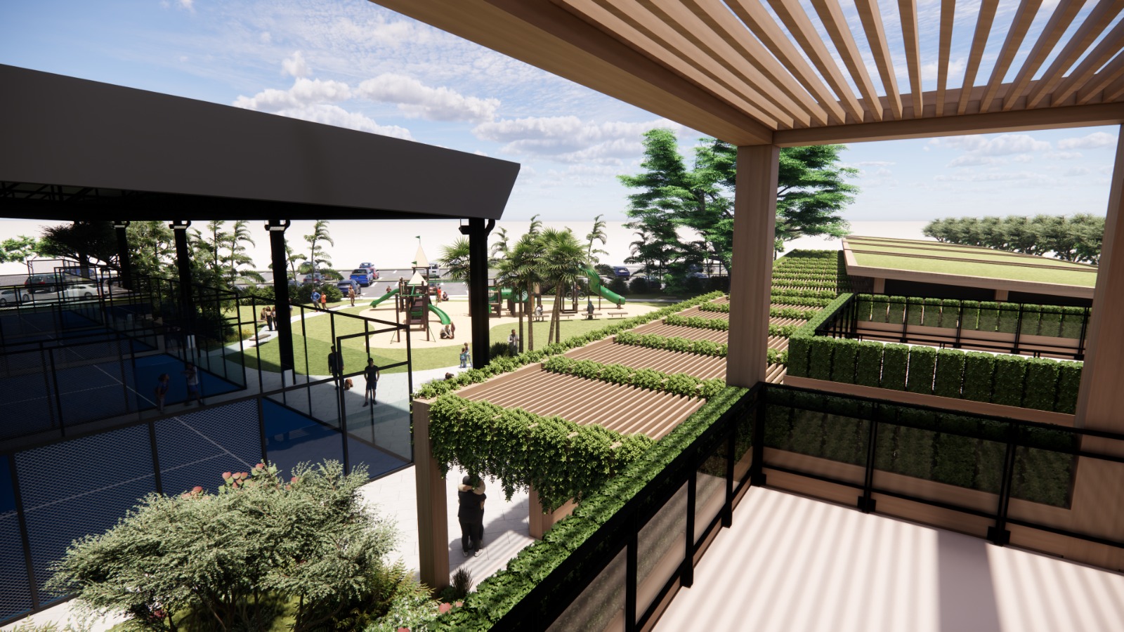 Estuari Sports Centre: green walkway buildings facing the playground and courts