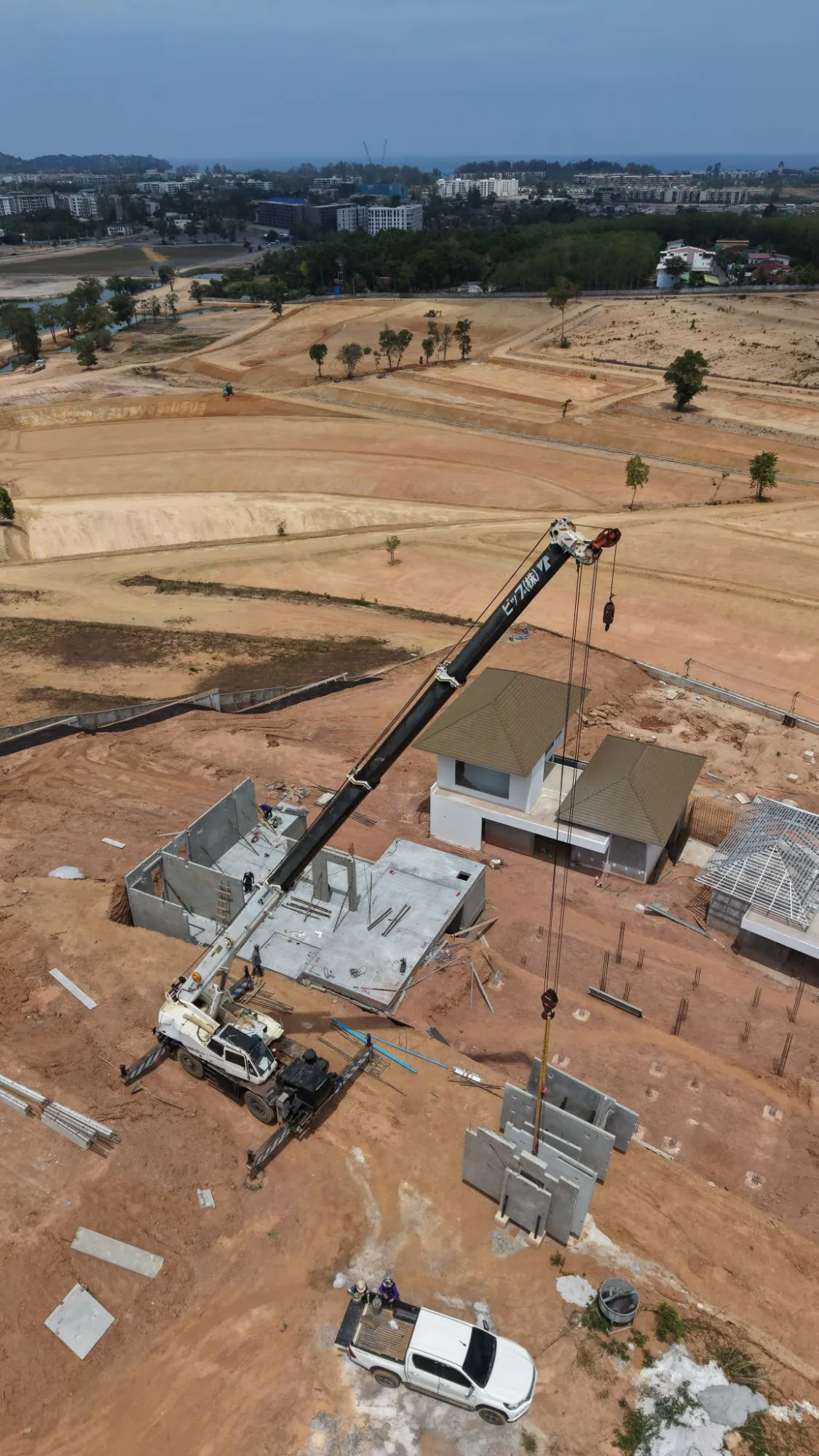 Aerial view of precast wall panels staged for erection at KAHLI Hillside Villas